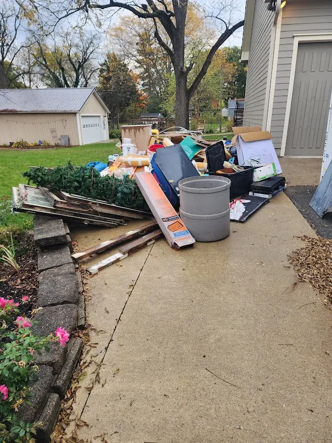 Dumpster being loaded with debris for 3 Yard Dumpster Rental in Wilmington Island